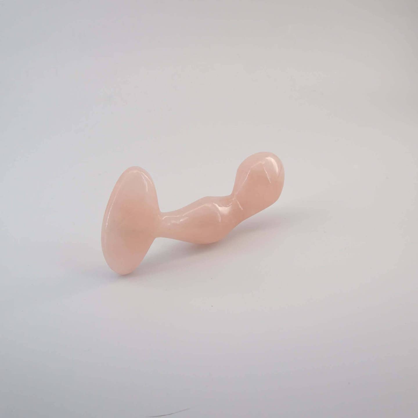 Aetheris handcrafted rose quartz crystal wellness wand made from natural rose quartz for meditation, mindfulness, energy work, relaxation, and luxury self-care rituals.