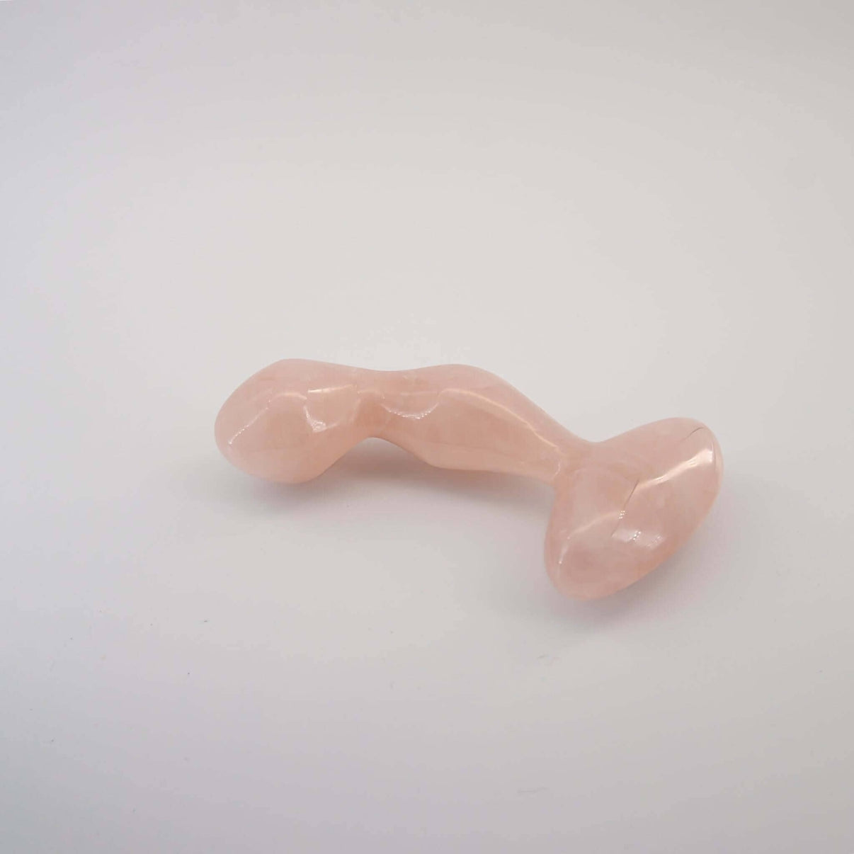 Aetheris handcrafted rose quartz crystal wellness wand made from natural rose quartz for meditation, mindfulness, energy work, relaxation, and luxury self-care rituals.