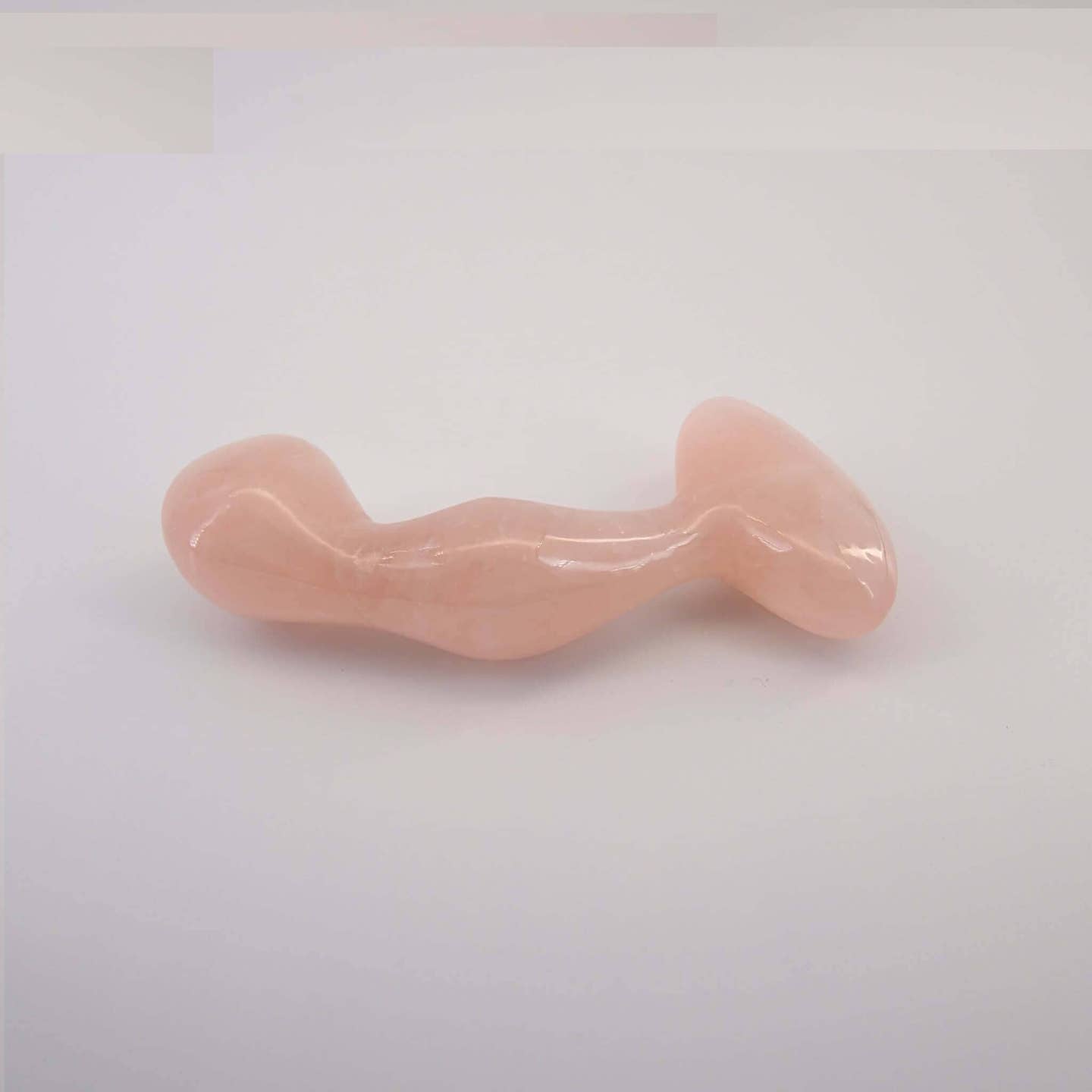 Aetheris handcrafted rose quartz crystal wellness wand made from natural rose quartz for meditation, mindfulness, energy work, relaxation, and luxury self-care rituals.