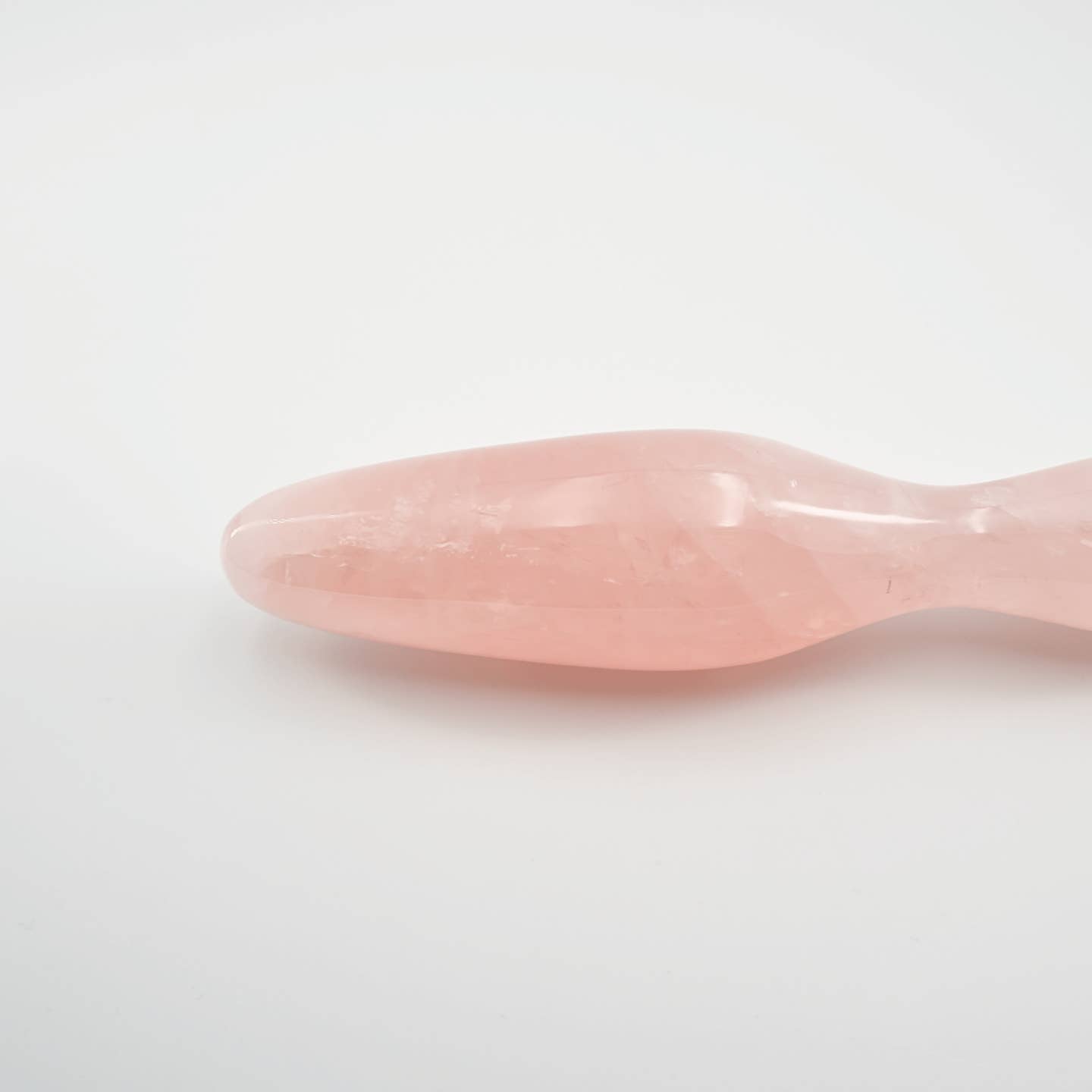Ellure handcrafted rose quartz crystal wellness wand made from natural rose quartz for meditation, mindfulness, relaxation, energy work, chakra balancing, and luxury self-care rituals.