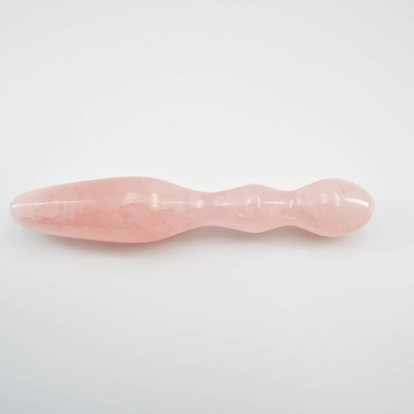 Ellure handcrafted rose quartz crystal wellness wand made from natural rose quartz for meditation, mindfulness, relaxation, energy work, chakra balancing, and luxury self-care rituals.