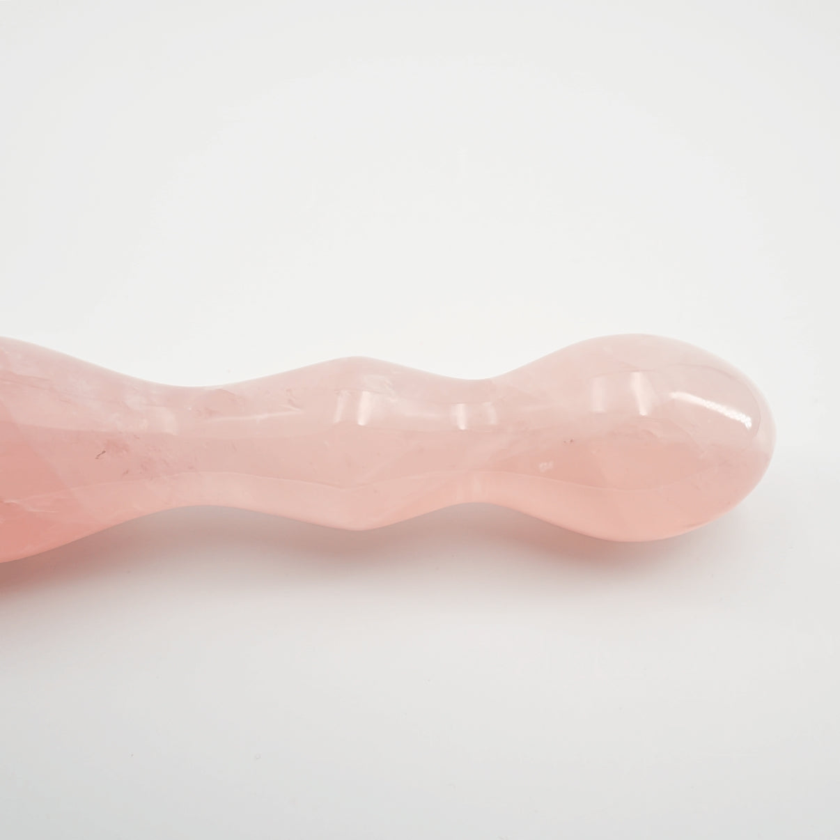 Ellure handcrafted rose quartz crystal wellness wand made from natural rose quartz for meditation, mindfulness, relaxation, energy work, chakra balancing, and luxury self-care rituals.