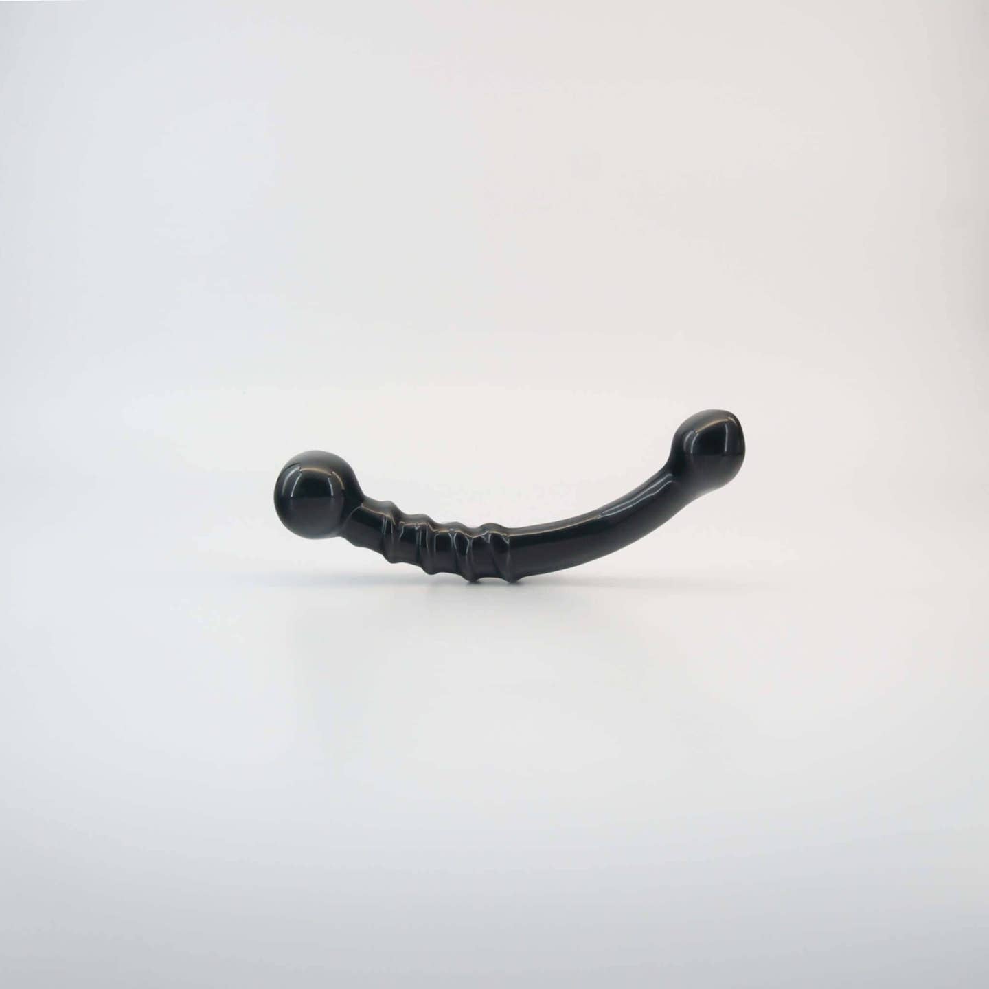 Nyxora handcrafted black obsidian crystal wellness wand made from natural obsidian for meditation, mindfulness, relaxation, energy work, massage, and luxury self-care rituals.
