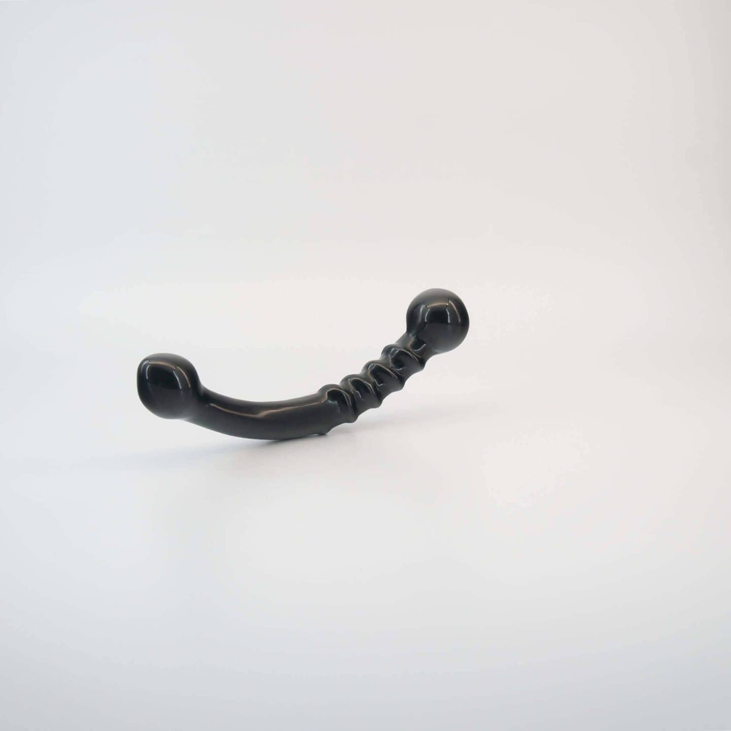 Nyxora handcrafted black obsidian crystal wellness wand made from natural obsidian for meditation, mindfulness, relaxation, energy work, massage, and luxury self-care rituals.