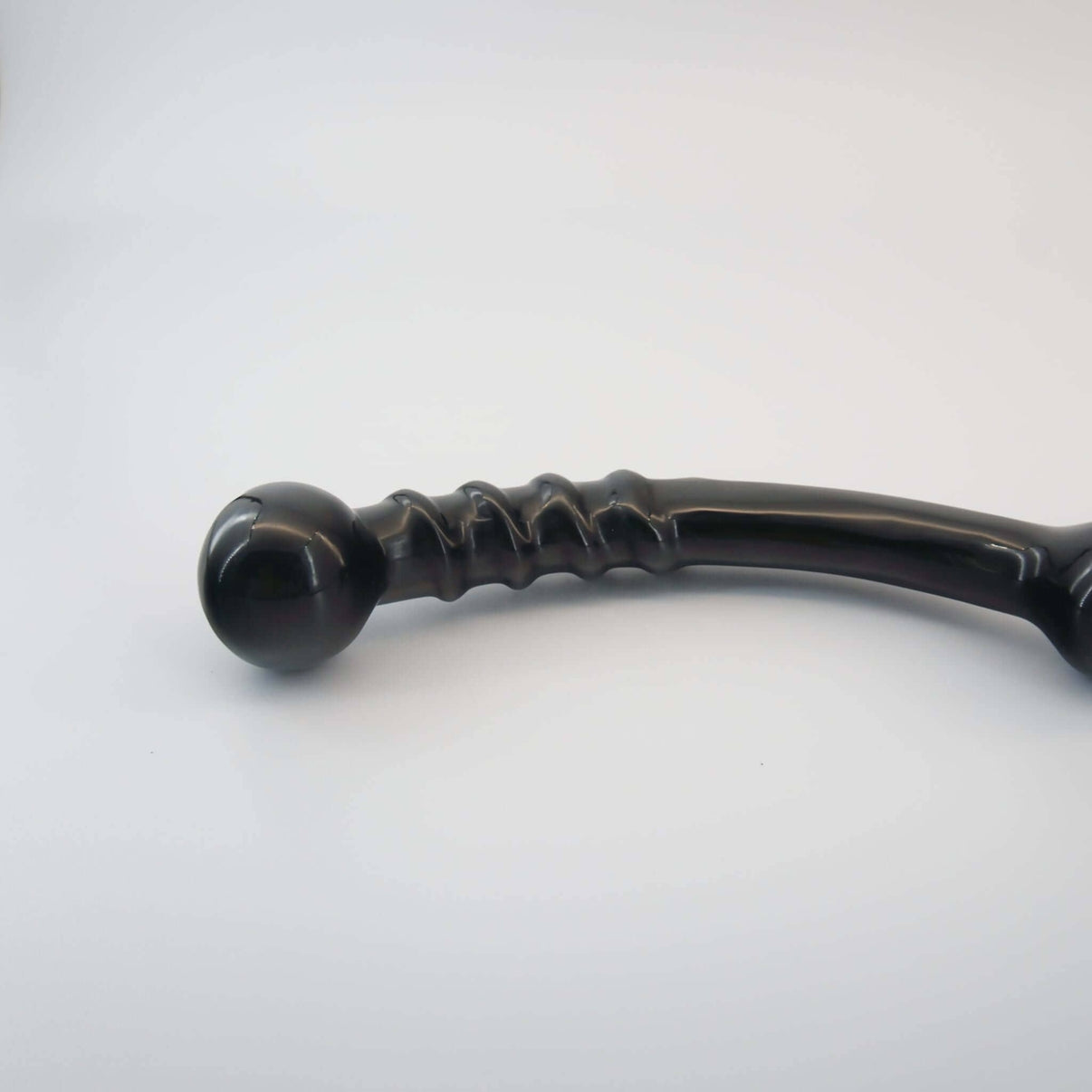 Nyxora handcrafted black obsidian crystal wellness wand made from natural obsidian for meditation, mindfulness, relaxation, energy work, massage, and luxury self-care rituals.