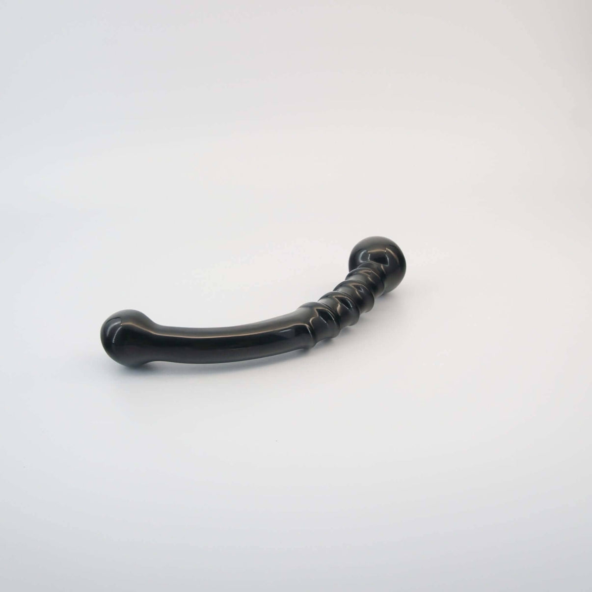 Nyxora handcrafted black obsidian crystal wellness wand made from natural obsidian for meditation, mindfulness, relaxation, energy work, massage, and luxury self-care rituals.