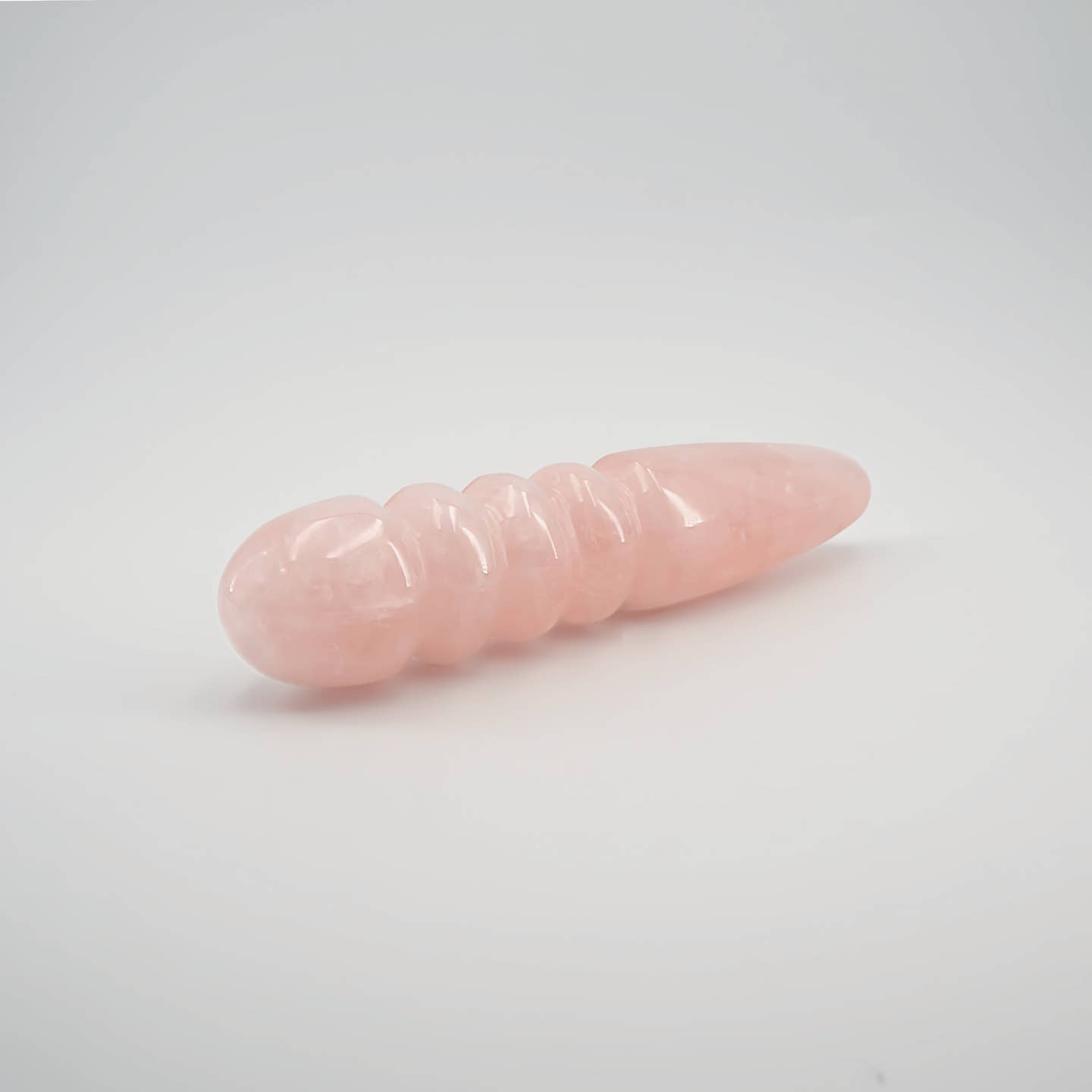 Unduluna handcrafted rose quartz crystal wand made from natural rose quartz for meditation, mindfulness, energy work, chakra balancing, relaxation, and luxury self-care rituals.