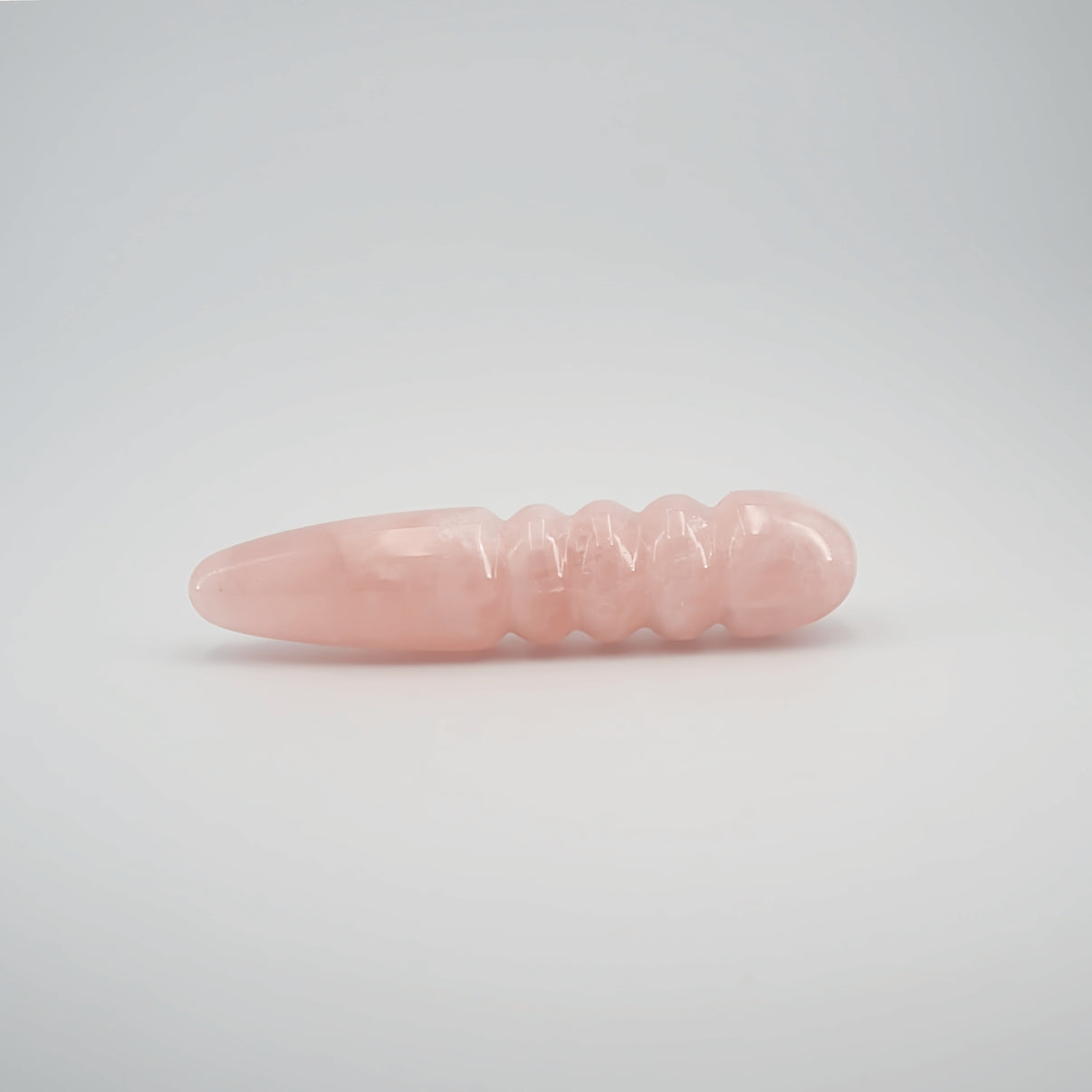 Unduluna handcrafted rose quartz crystal wand made from natural rose quartz for meditation, mindfulness, energy work, chakra balancing, relaxation, and luxury self-care rituals.