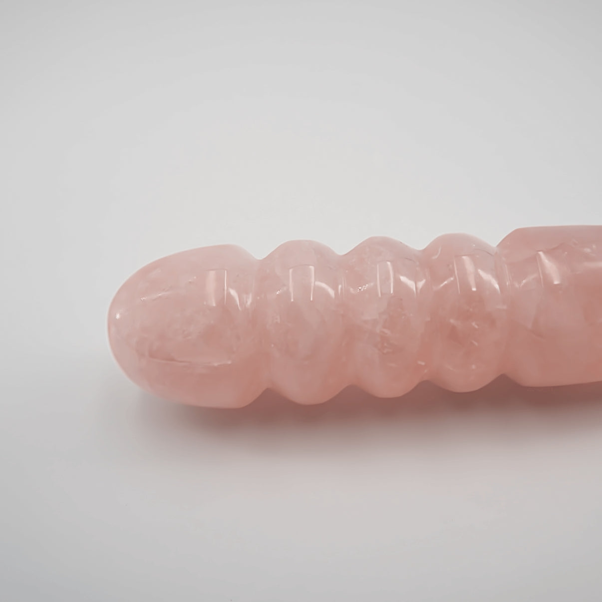 Unduluna handcrafted rose quartz crystal wand made from natural rose quartz for meditation, mindfulness, energy work, chakra balancing, relaxation, and luxury self-care rituals.