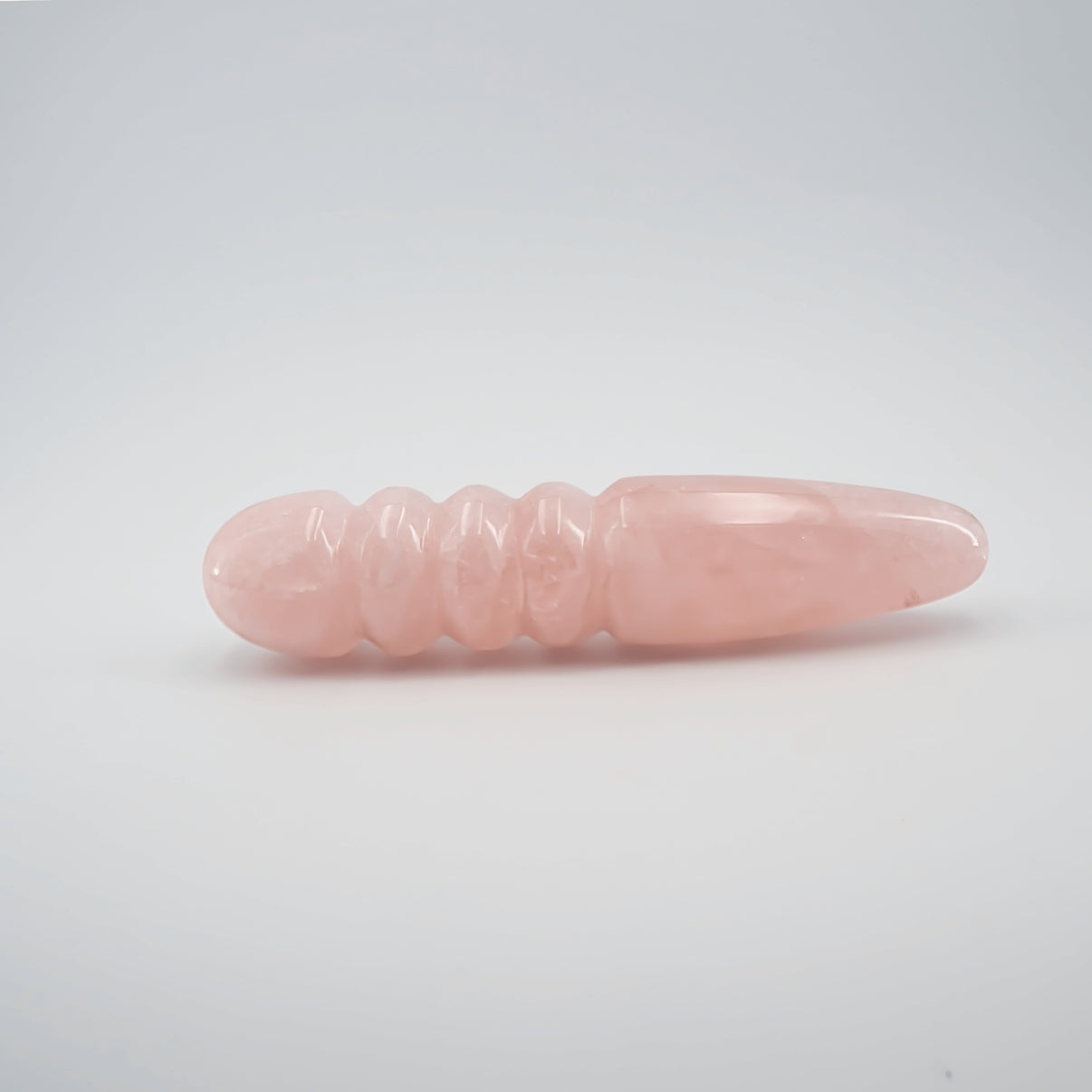 Unduluna handcrafted rose quartz crystal wand made from natural rose quartz for meditation, mindfulness, energy work, chakra balancing, relaxation, and luxury self-care rituals.