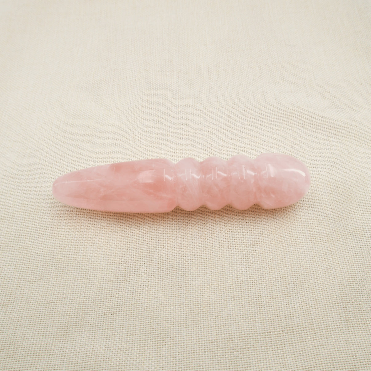 Unduluna handcrafted rose quartz crystal wand made from natural rose quartz for meditation, mindfulness, energy work, chakra balancing, relaxation, and luxury self-care rituals.
